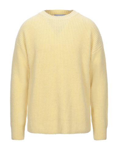 light yellow sweater