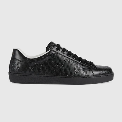 Shop Gucci Men's Ace Gg Embossed Sneaker In Black