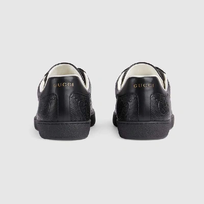 Shop Gucci Men's Ace Gg Embossed Trainer In Black