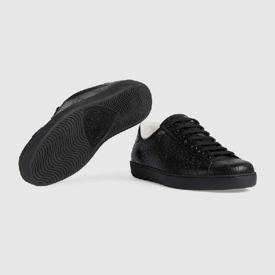 Shop Gucci Men's Ace Gg Embossed Sneaker In Black