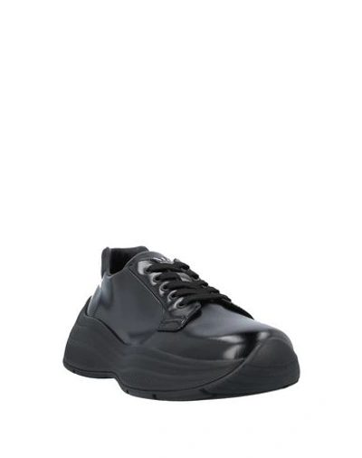 Shop Prada Sneakers In Black