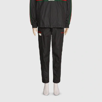 Shop Gucci Coated Cotton Pant With  Label In Black