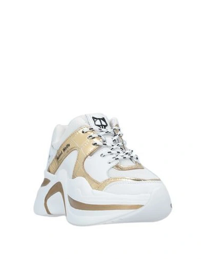 Shop Naked Wolfe Sneakers In White