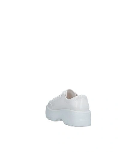 Shop Melissa Sneakers In White