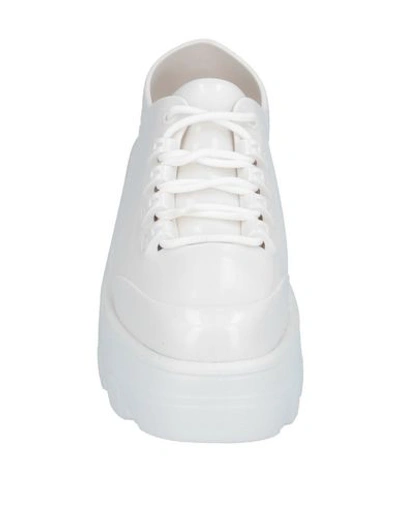 Shop Melissa Sneakers In White
