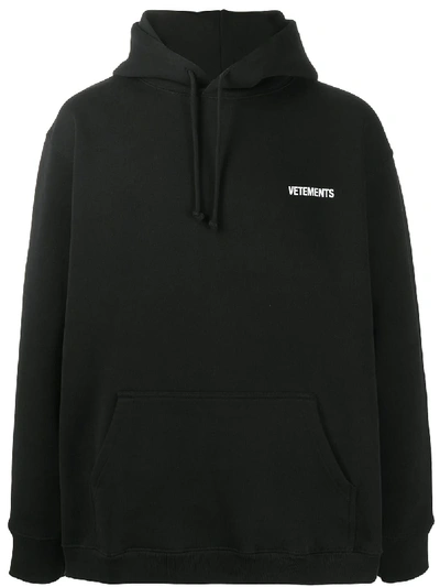 Shop Vetements Long Sleeve Logo Hoodie In Black