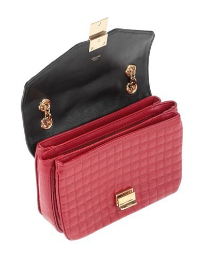 Shop Celine Handbags In Red