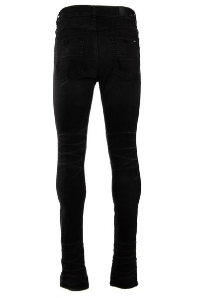 Shop Amiri Stonewashed Jeans In Black