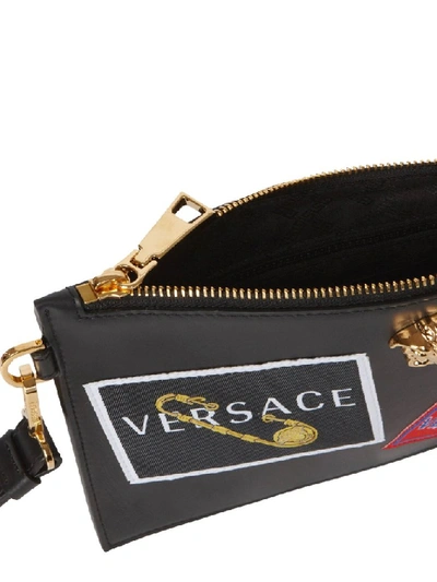 Shop Versace Patch Print Clutch Bag In Black