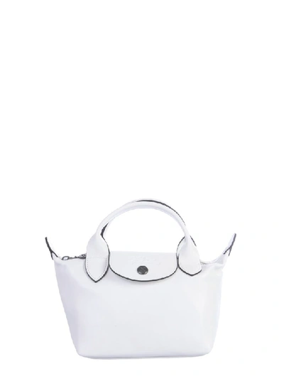 Shop Longchamp Le Pliage Cuir Top Handle Bag In White