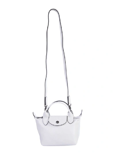 Shop Longchamp Le Pliage Cuir Top Handle Bag In White