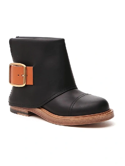 Shop Alexander Mcqueen Buckle Detail Ankle Boots In Black