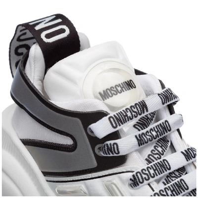 Shop Moschino Teddy Panelled Sneakers In White