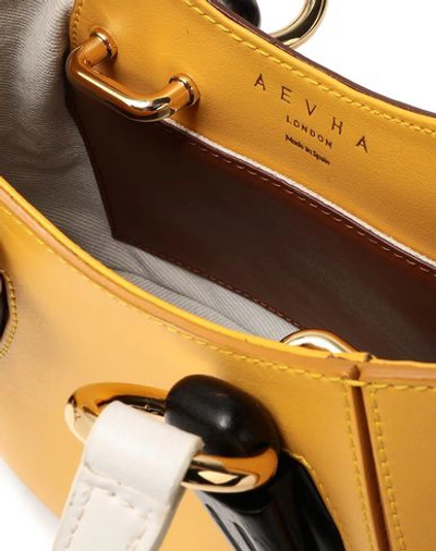 Shop Aevha London Handbag In Yellow