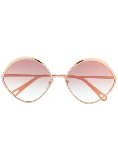 Shop Chloé Oval Frame Sunglasses In Metallic