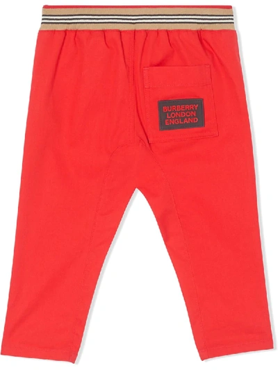 Shop Burberry Icon Stripe Track Pants In Red