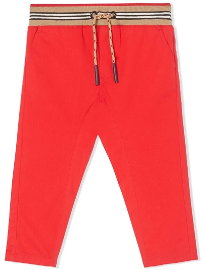 Shop Burberry Icon Stripe Track Pants In Red