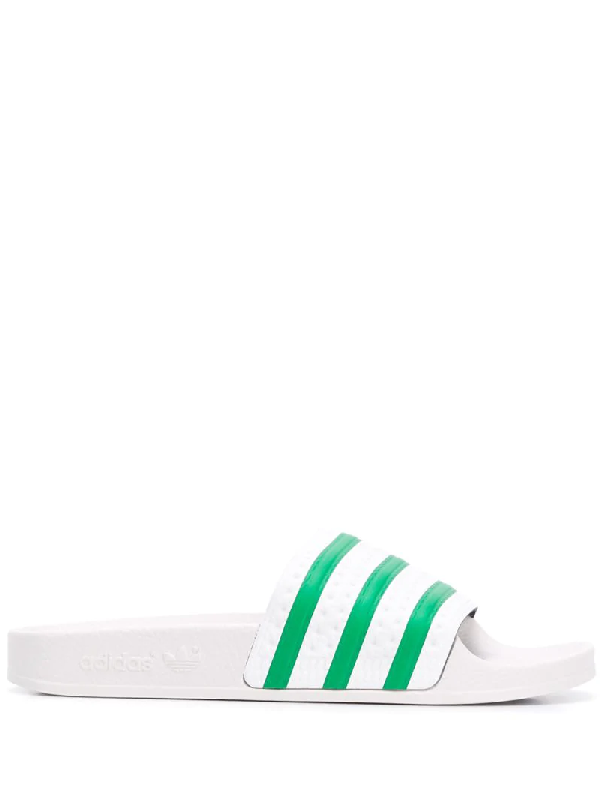 green and white adidas slides