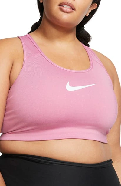 Shop Nike Dry Swoosh Bold Sports Bra In Magic Flamingo/ Pure/ White