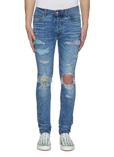 Shop Amiri Hawaiian Patch Distressed Skinny Jeans In Blue