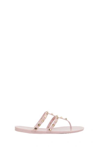 Shop Valentino Rockstud Thong Sandals In Rubber In Cipria