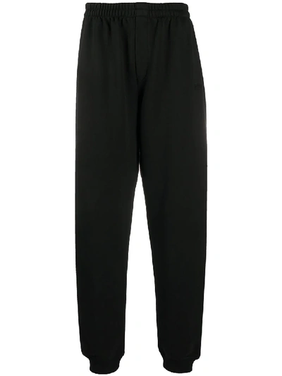 Shop Vetements Logo Embroidered Loose Fit Track Pants In Black