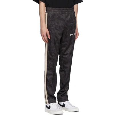 Shop Palm Angels Black Croco Track Pants