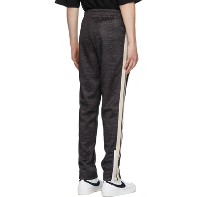 Shop Palm Angels Black Croco Track Pants