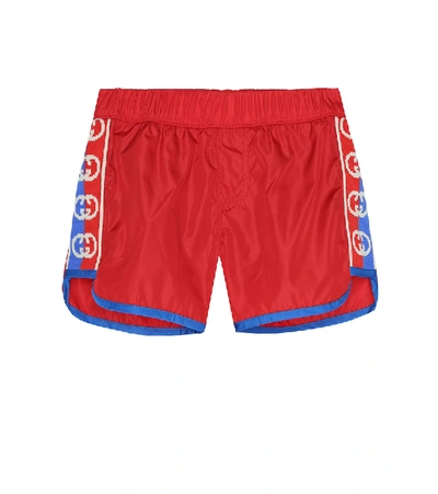 Shop Gucci Baby Interlocking G Swim Trunks In Red