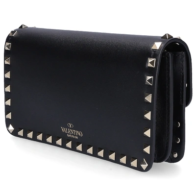Shop Valentino Garavani Women Handbag Pouch Calfskin Logo Rivet Gold Black