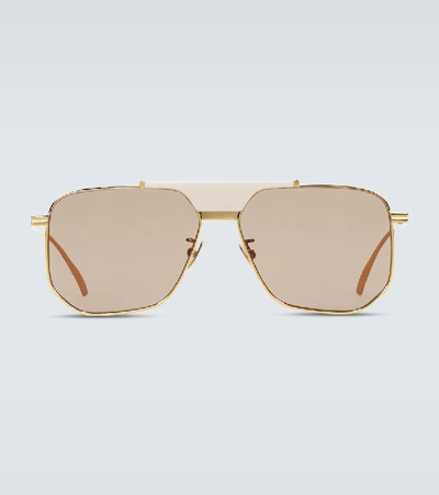 Shop Bottega Veneta Aviator Frame Sunglasses In Gold