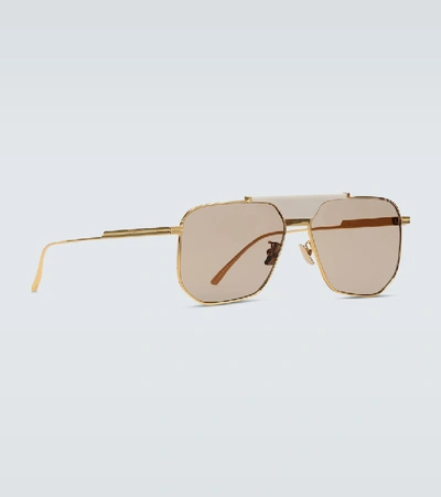 Shop Bottega Veneta Aviator Frame Sunglasses In Gold