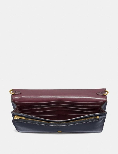 Shop Coach Hayden Foldover Crossbody Clutch In Colorblock Signature Canvas - Women's In Charcoal/midnight Navy/gold