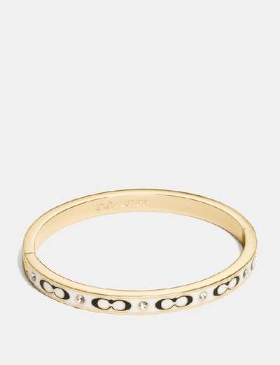 Shop Coach Signature Stone Hinged Bangle In Gold/chalk