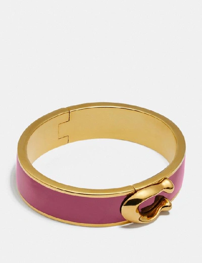 Shop Coach Signature Large Hinged Bangle In Gold/ Dusty Rose