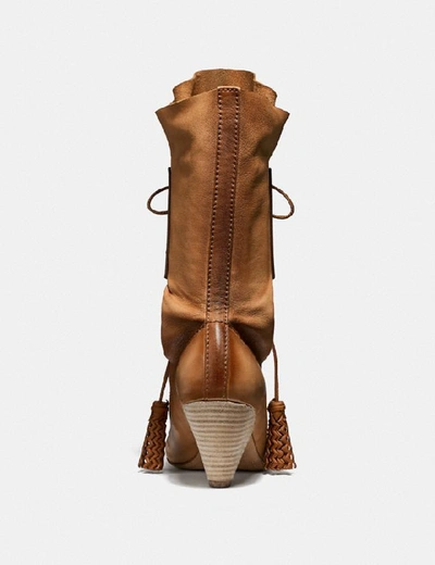 Shop Coach Lace Up Tassle Boot In Brown