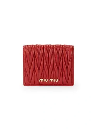 Shop Miu Miu Matelassé Leather Bi-fold Wallet In Fuoco