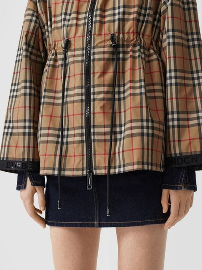 Shop Burberry Check Lightweight Jacket In Archive Beige