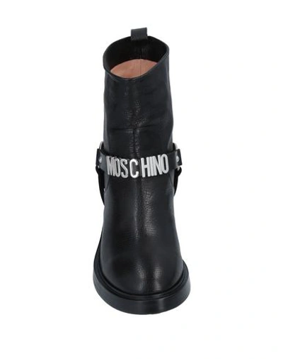 Shop Moschino Ankle Boot In Black