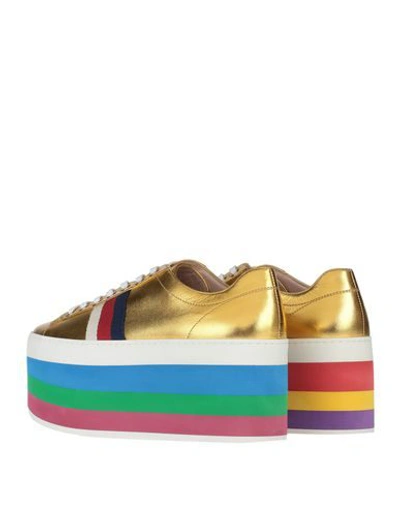 Shop Gucci Sneakers In Gold