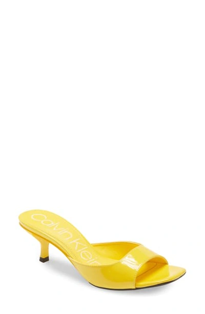 Shop Calvin Klein Mega Kitten Heel Slide Sandal In Scuba Yellow Patent Leather