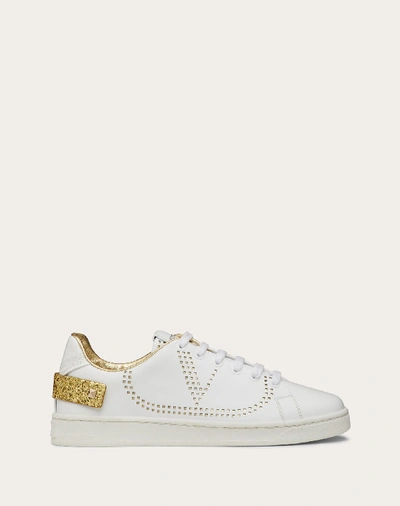 Shop Valentino Garavani Backnet Calfskin Sneaker In White/gold