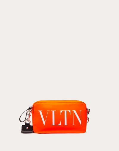 Shop Valentino Garavani Uomo Vltn Fluorescent Leather Crossbody Bag In Florescent Orange