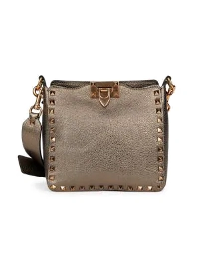 Shop Valentino Garavani Mini Rockstud Metallic Leather Hobo Bag In Sasso