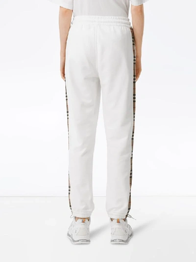 Shop Burberry Check-stripe Track Pants In White