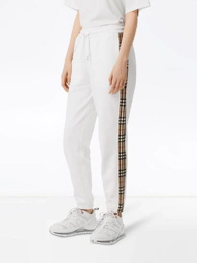 Shop Burberry Check-stripe Track Pants In White