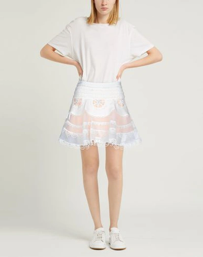 Shop Amuse Mini Skirts In White