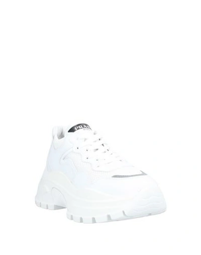 Shop Prada Sneakers In White