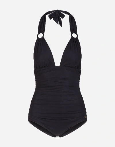 Shop Dolce & Gabbana Solid-color One-piece Swimsuit With Plunging Neckline In Black