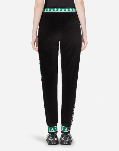 Shop Dolce & Gabbana Velvet Jogging Pants With Dg Logo Bands In Black